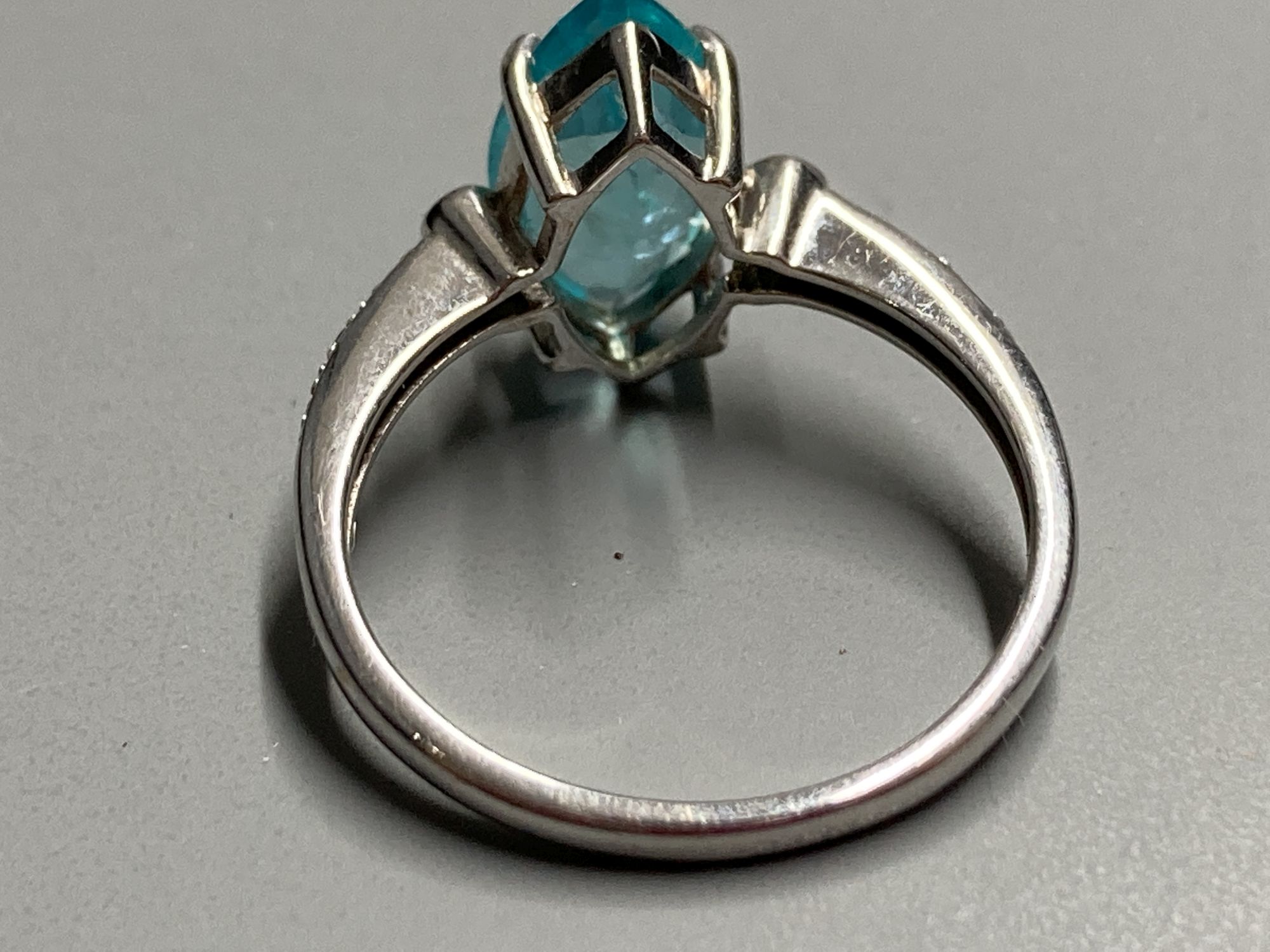 Three assorted modern 9ct and gem set dress rings, including white gold and marquise shaped blue topaz ring, size N/O,